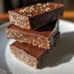 Close-up side view of homemade chocolate protein bars, showcasing their textures and ingredients.