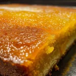 Close-up view of a moist cake au potimarron with a textured surface.