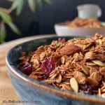 Close-up of a bowl filled with granola featuring chestnuts and cinnamon.