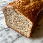 Close-up view of gluten-free pain d'épices, showcasing its moist texture and rich spices.