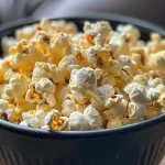 Close-up view of sweet popcorn coated with cinnamon and muscovado sugar.