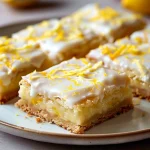 Close-up view of a decadent white chocolate and lemon brownie topped with colorful sprinkles.